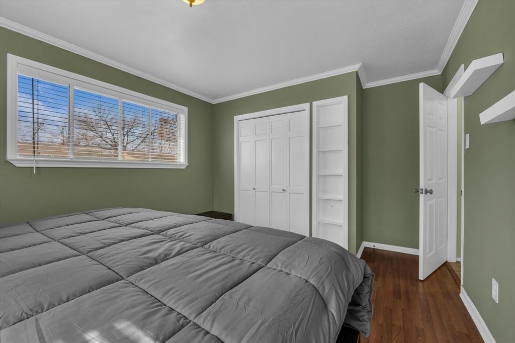 1007 North 57th Street Waco, TX 76710 - Photo 19 of 38 a bedroom with a bed and a window