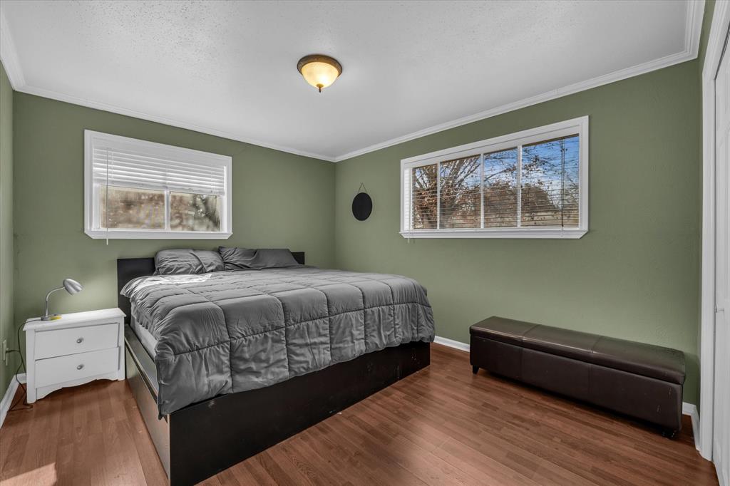 1007 North 57th Street Waco, TX 76710 - Photo 20 of 38 a bedroom with a bed and a painting on the wall