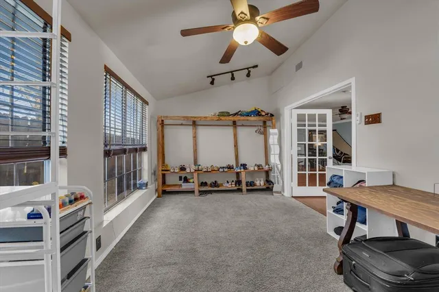 a view of a livingroom with furniture and a window