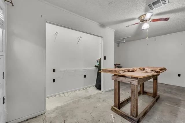 a utility room with a stove a washer and dryer