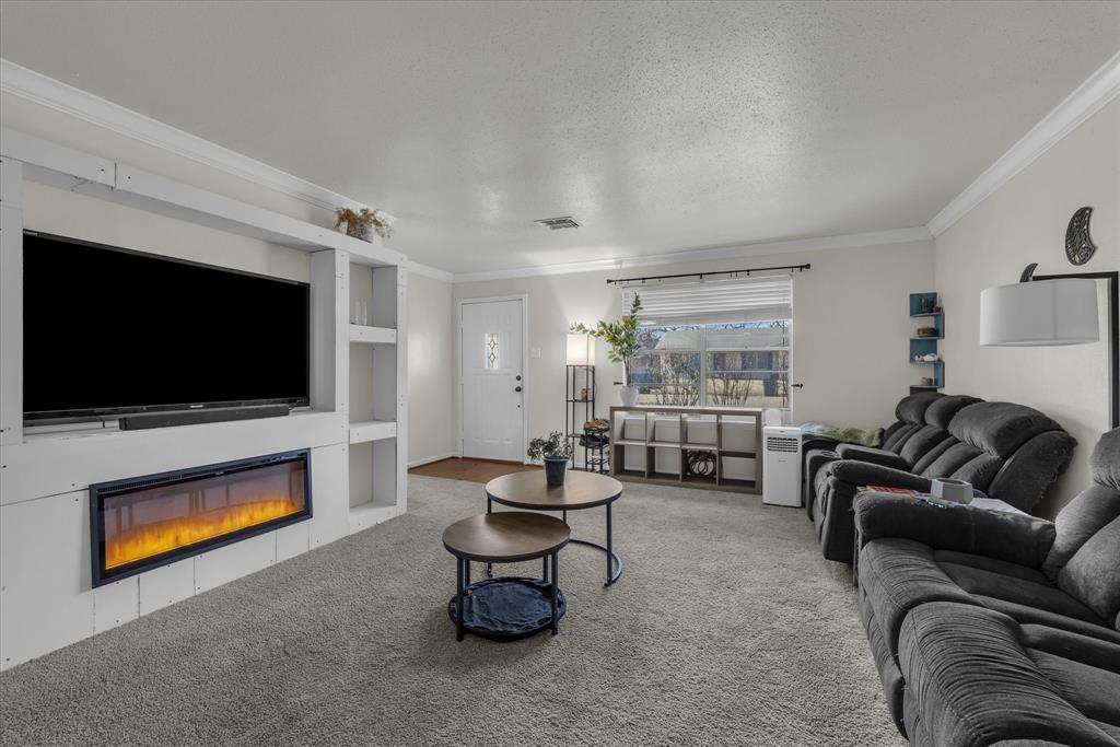 1007 North 57th Street Waco, TX 76710 - Photo 9 of 38 a living room with furniture and a flat screen tv