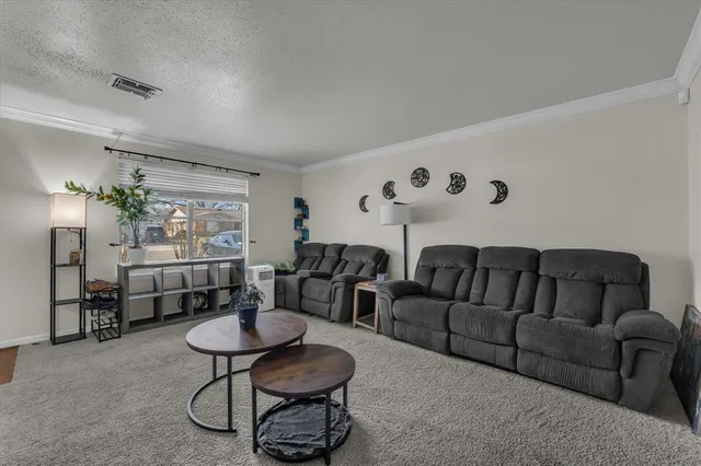 a living room with furniture and a table