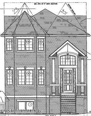 a view of a brick house with many windows