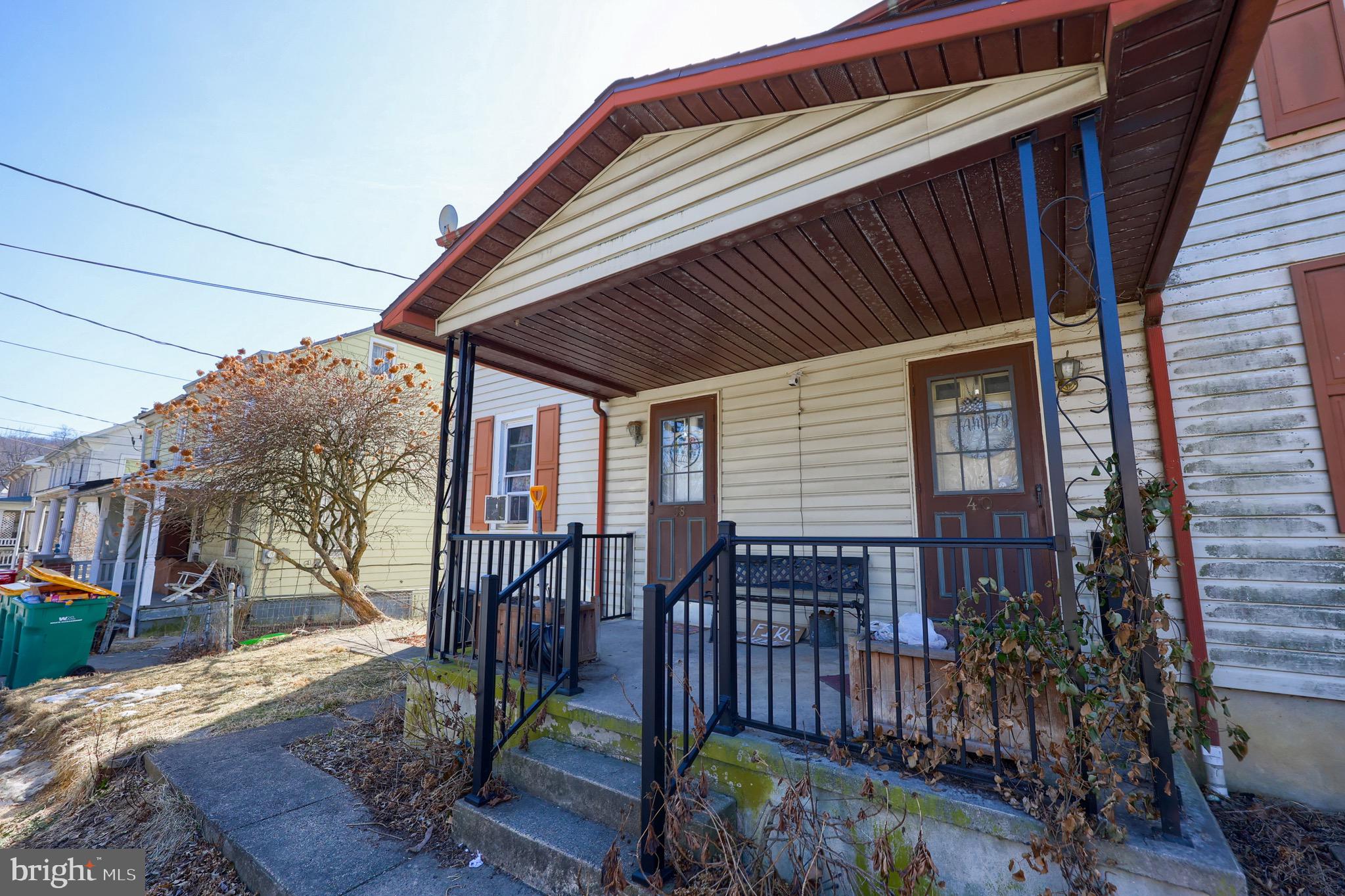 38 Montello Road Reading, PA 19608 - Photo 1 of 25 a view of house with a large window and wooden fence