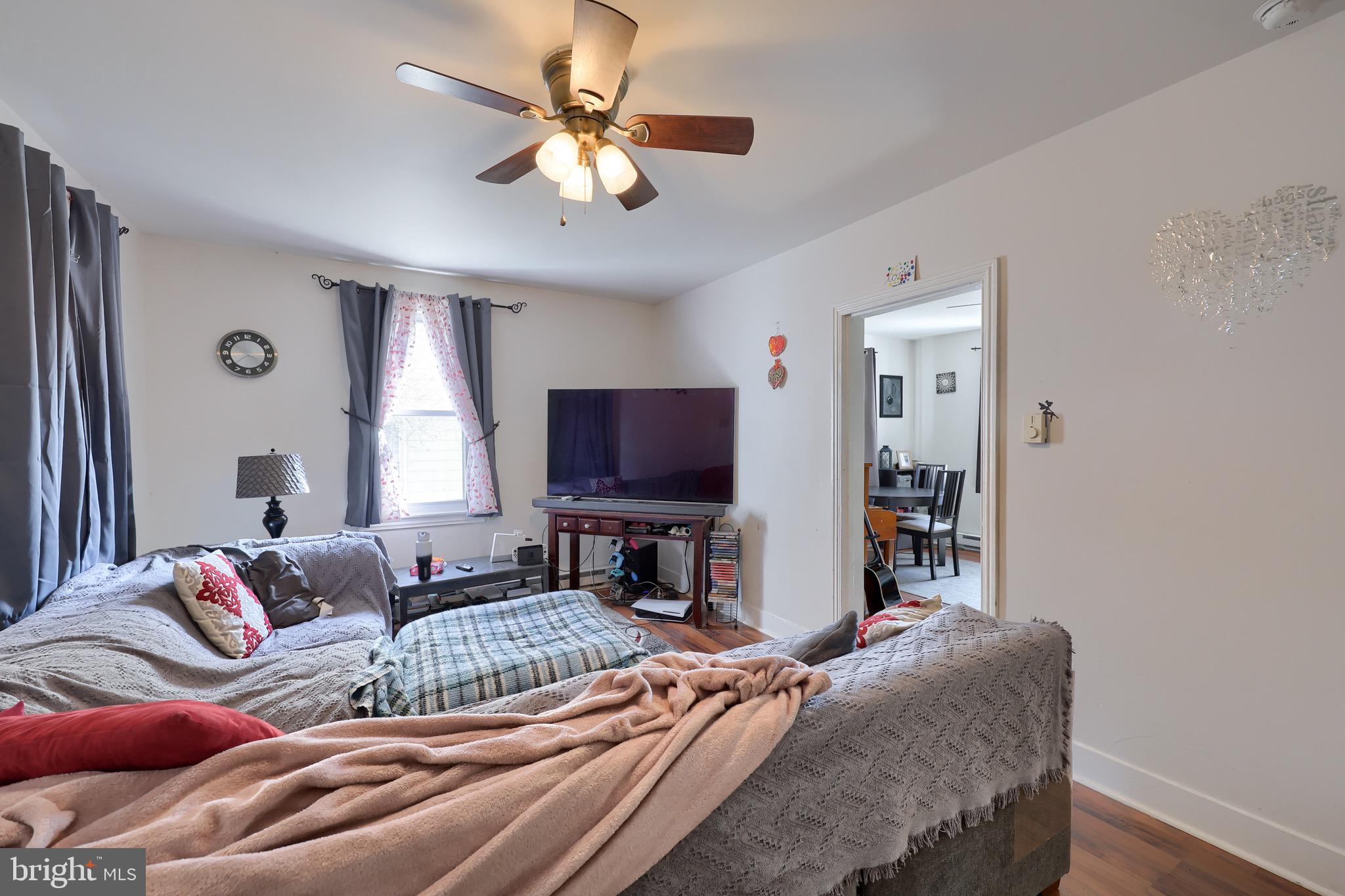 38 Montello Road Reading, PA 19608 - Photo 11 of 25 a bedroom with a bed and a flat screen tv