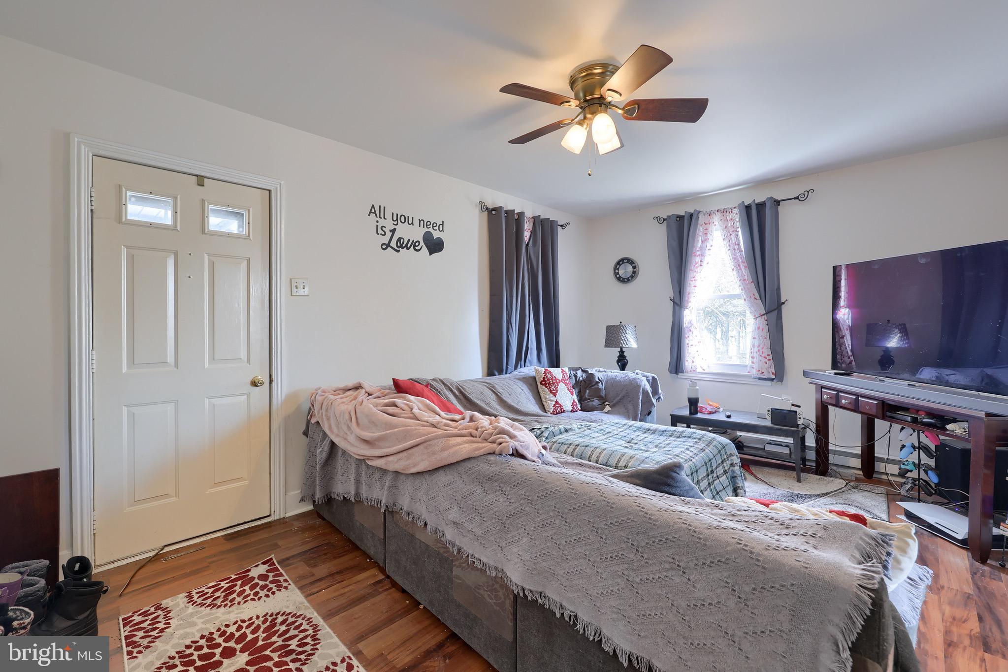 38 Montello Road Reading, PA 19608 - Photo 7 of 25 a bedroom with a bed and a chandelier