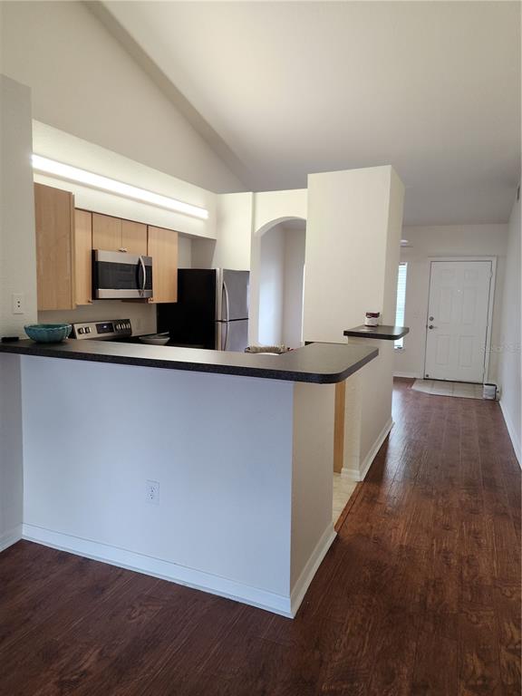 3648 Kings Road, Unit 103 Palm Harbor, FL 34685 - Photo 12 of 26 a kitchen with stainless steel appliances a sink and a stove