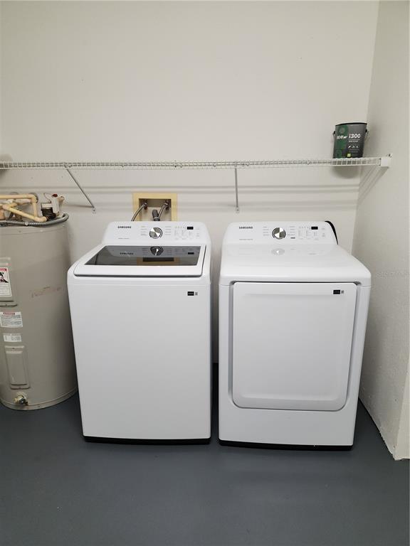 3648 Kings Road, Unit 103 Palm Harbor, FL 34685 - Photo 13 of 26 a utility room with dryer and washer