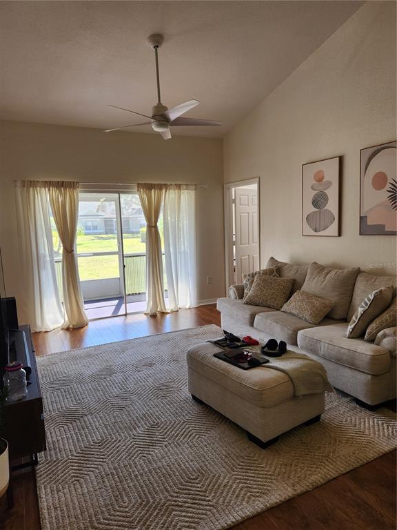 3648 Kings Road, Unit 103 Palm Harbor, FL 34685 - Photo 6 of 26 a living room with furniture and a large window