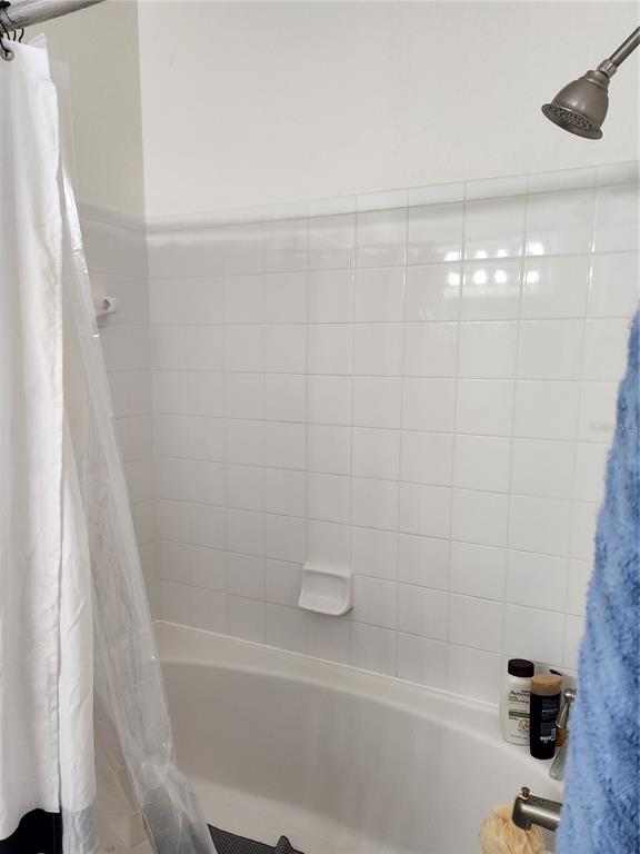 3648 Kings Road, Unit 103 Palm Harbor, FL 34685 - Photo 9 of 26 a bathroom with a bathtub