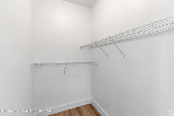 a view of a room with racks on the wall