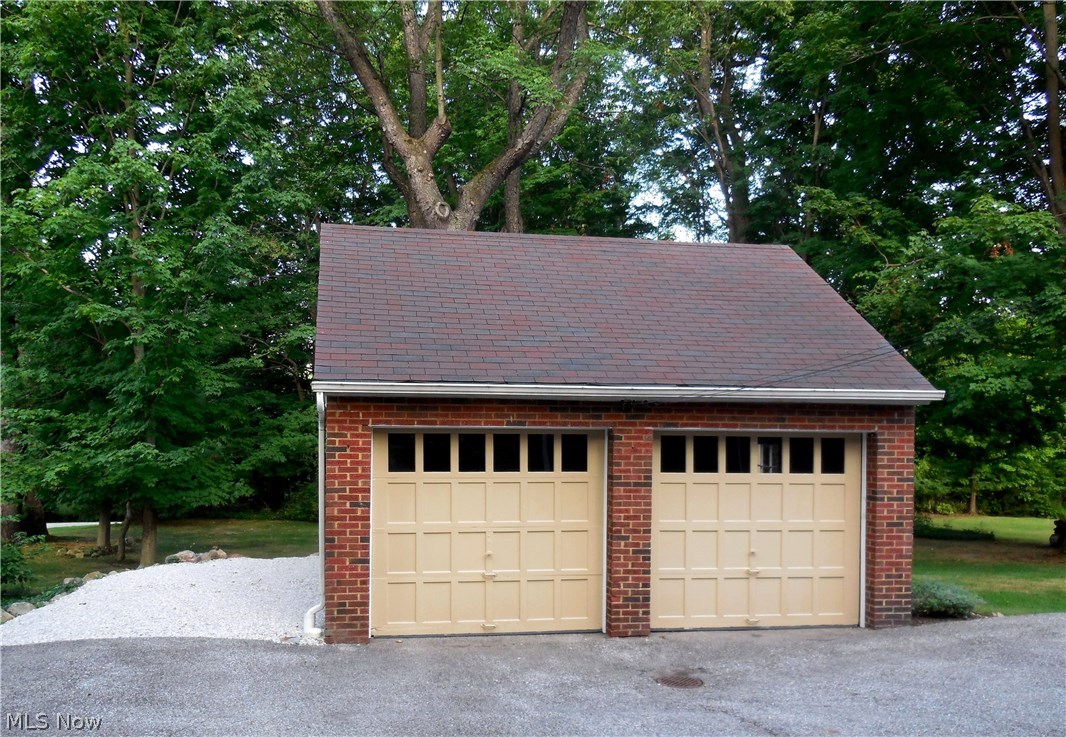 Garage has gravel area on the left to add an additional garage bay or park your RV. Another garage bay can be added on the right of the current garage also!
