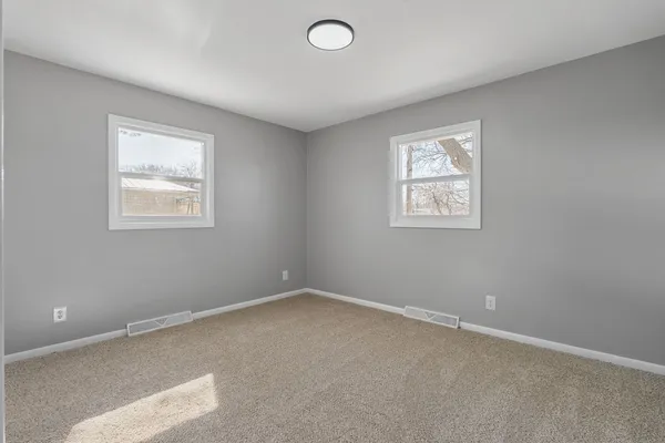 an empty room with windows