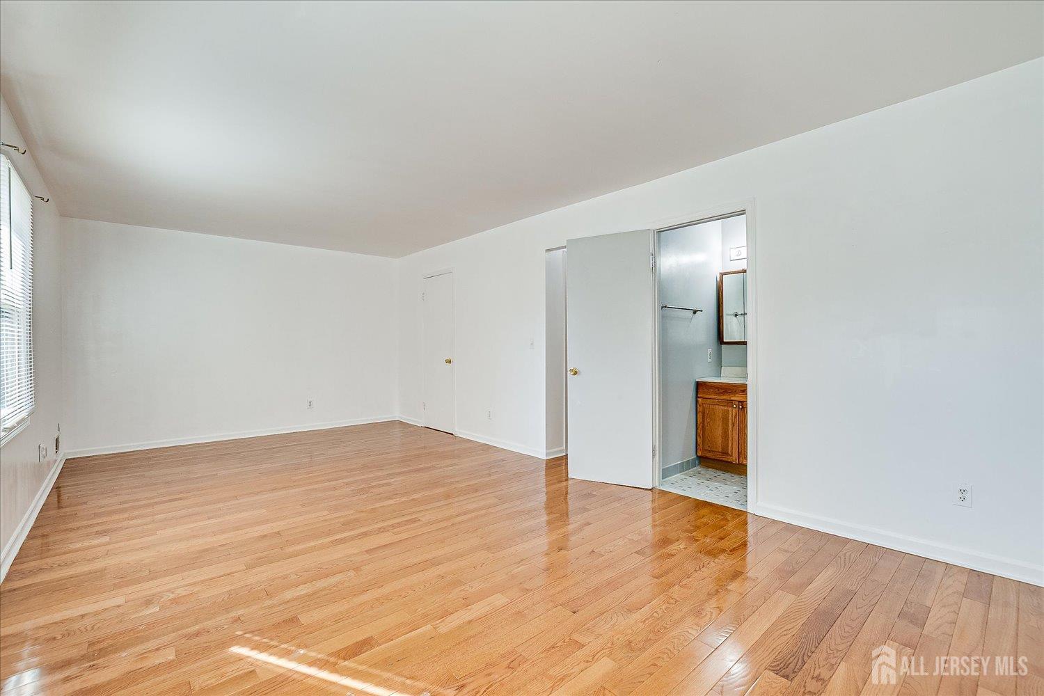 536 Elsie Avenue South Plainfield, NJ 07080 - Photo 16 of 28 a view of an empty room and wooden floor