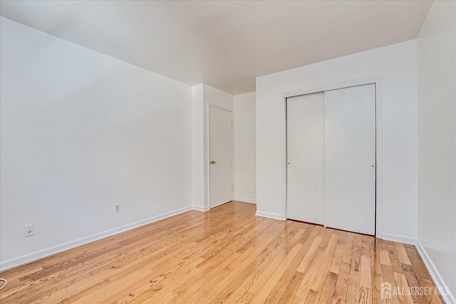536 Elsie Avenue South Plainfield, NJ 07080 - Photo 23 of 28 a view of empty room with wooden floor