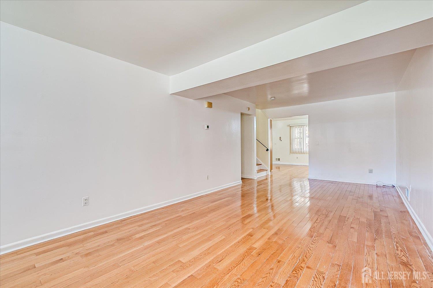 536 Elsie Avenue South Plainfield, NJ 07080 - Photo 5 of 28 a view of empty room with wooden floor