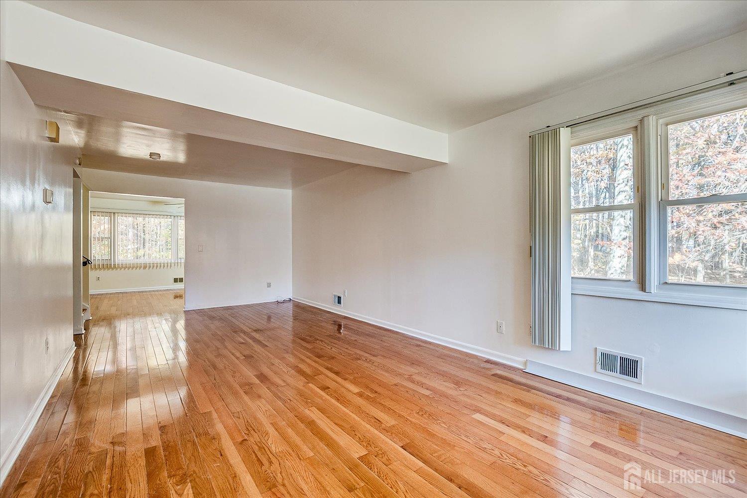 536 Elsie Avenue South Plainfield, NJ 07080 - Photo 6 of 28 a view of empty room with wooden floor and fan
