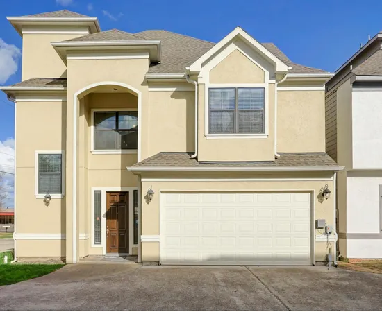 a front view of a house with a garage