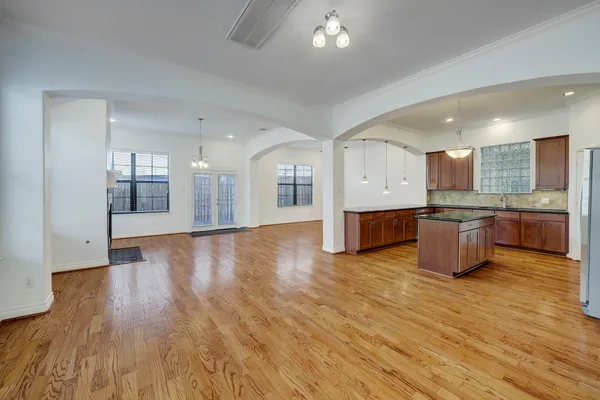 a large kitchen with stainless steel appliances granite countertop a large counter top and a stove
