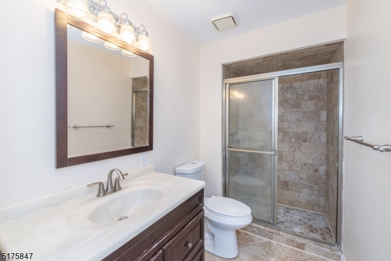 71 Patriots Road Morris Plains, NJ 07950 - Photo 15 of 18 a bathroom with a sink and a mirror