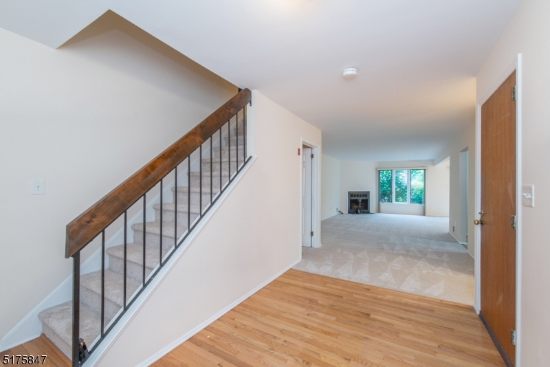 71 Patriots Road Morris Plains, NJ 07950 - Photo 2 of 18 a view of an entryway with wooden floor and stairs