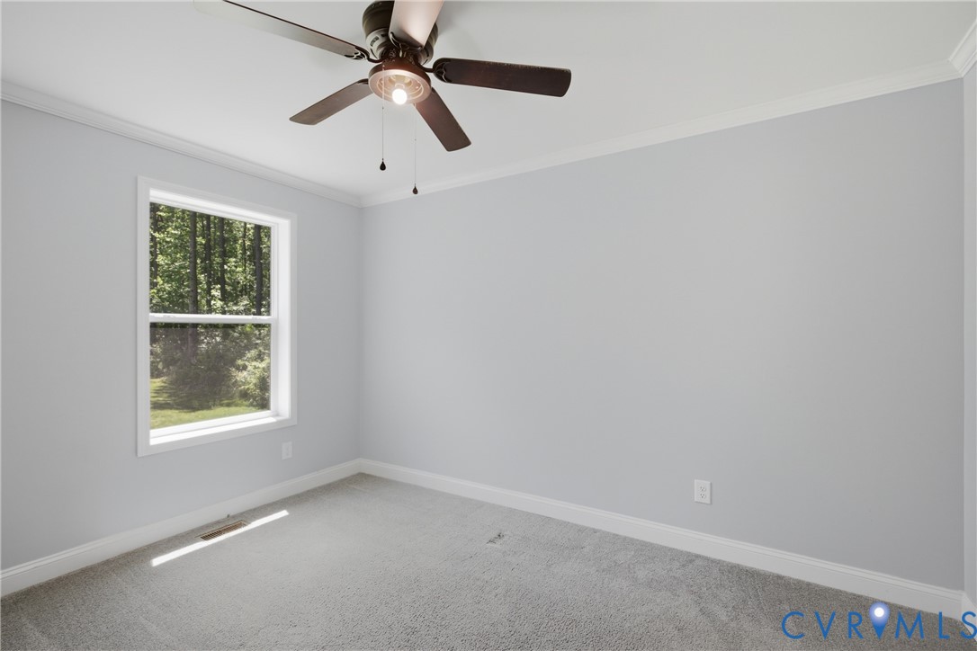 93 Faraway Road Saluda, VA 23149 - Photo 25 of 58 an empty room with a window and a fan