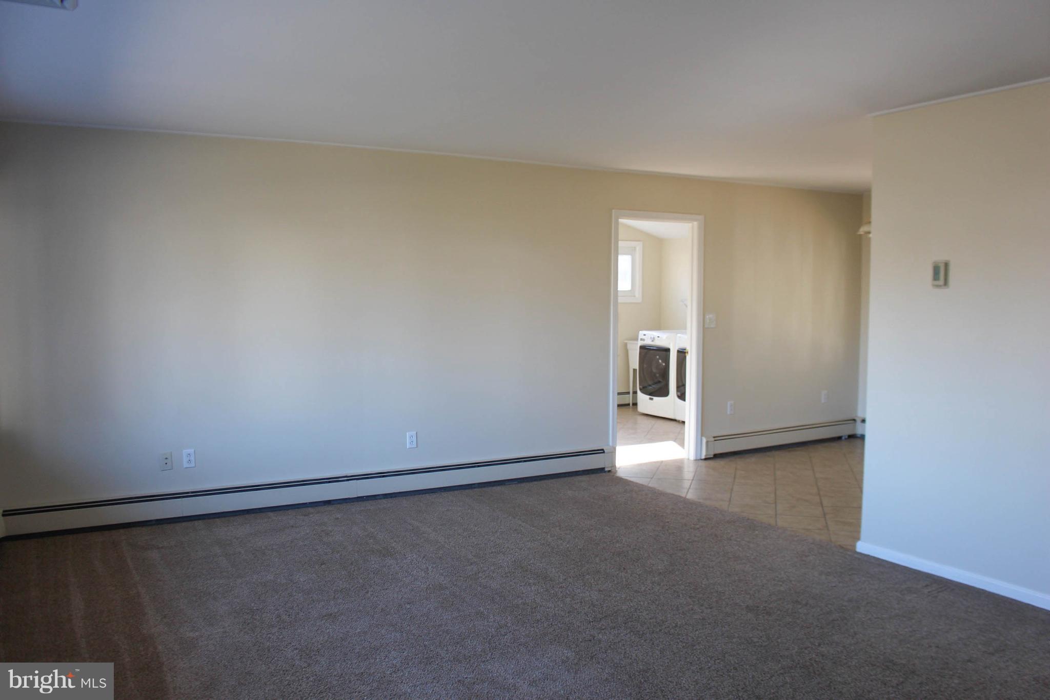 15 Long Loop Road Levittown, PA 19056 - Photo 13 of 34 Living room looking at Laundry room