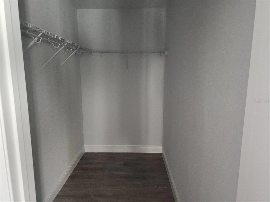 1111 Dagmar Avenue Spring Hill, FL 34606 - Photo 14 of 27 a view of a room with wooden floor