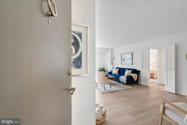 a front view of a building with a garden