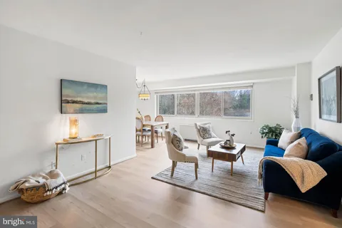 a view of a livingroom with furniture and a window