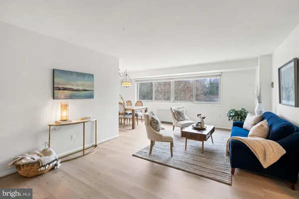 a view of a livingroom with furniture and a window