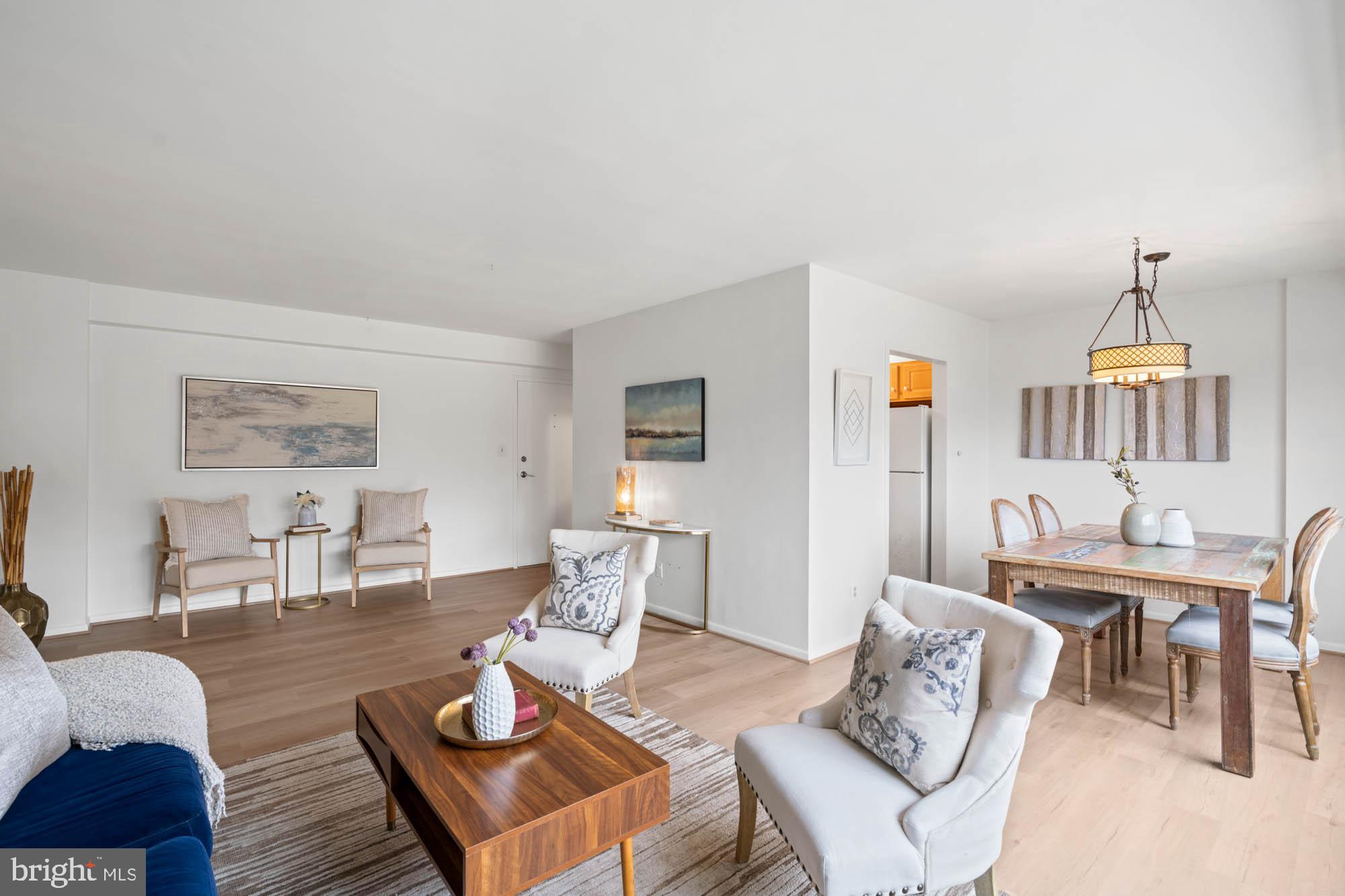 5100 Dorset Avenue, Unit 111 Chevy Chase, MD 20815 - Photo 19 of 38 a living room with furniture a table and chair