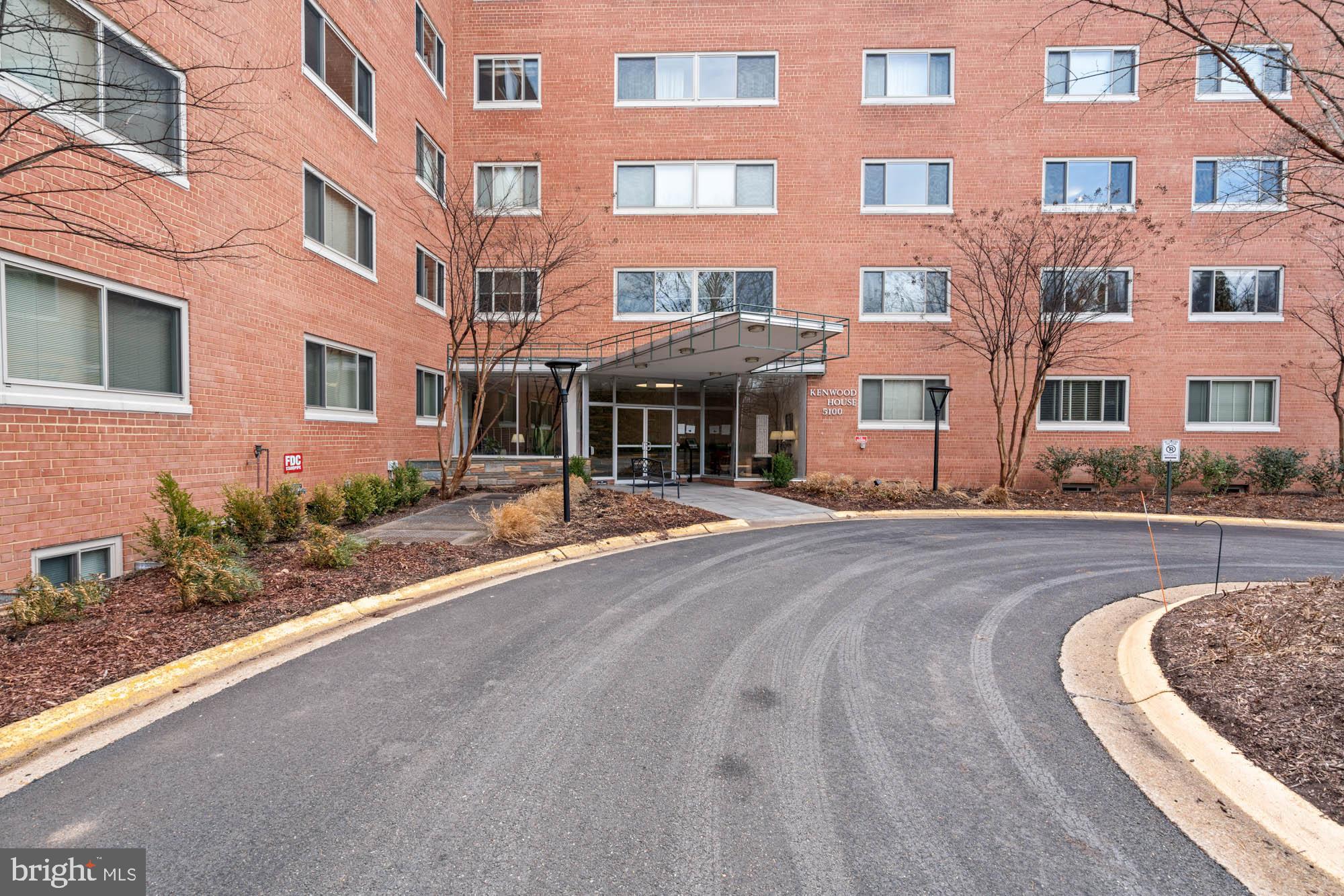 5100 Dorset Avenue, Unit 111 Chevy Chase, MD 20815 - Photo 2 of 38 a front view of a building with a garden