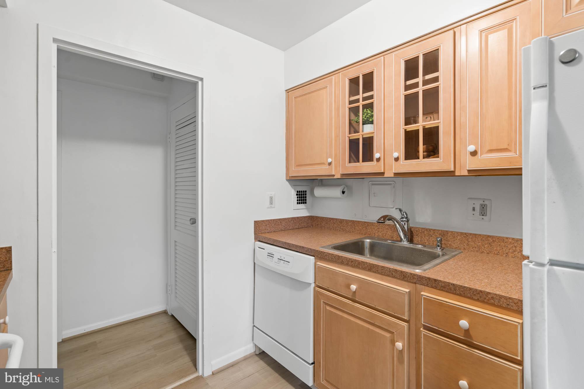 5100 Dorset Avenue, Unit 111 Chevy Chase, MD 20815 - Photo 28 of 38 a kitchen with a sink and cabinets