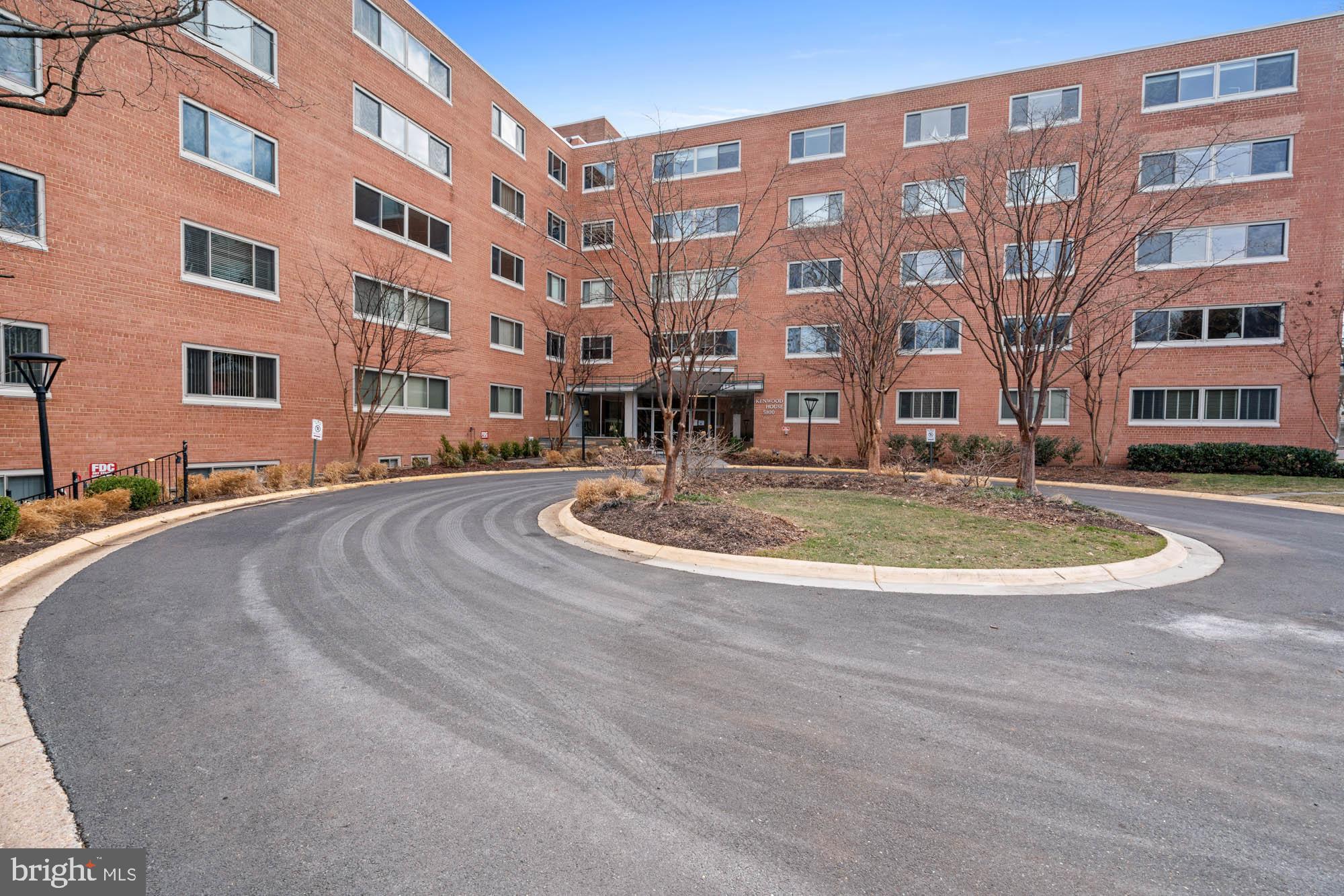 5100 Dorset Avenue, Unit 111 Chevy Chase, MD 20815 - Photo 3 of 38 a view of tall building with a yard
