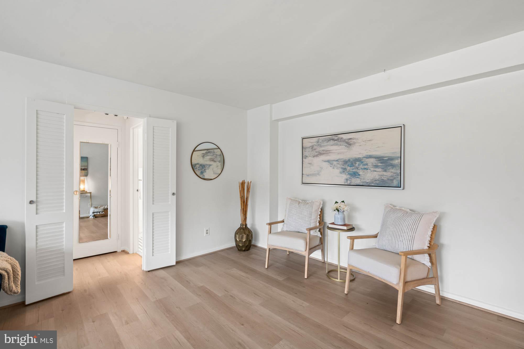 5100 Dorset Avenue, Unit 111 Chevy Chase, MD 20815 - Photo 31 of 38 a living room with furniture and a wooden floor