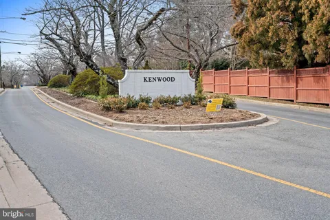 a living room with furniture a flat screen tv and a large window