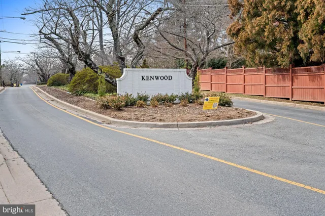a living room with furniture a flat screen tv and a large window