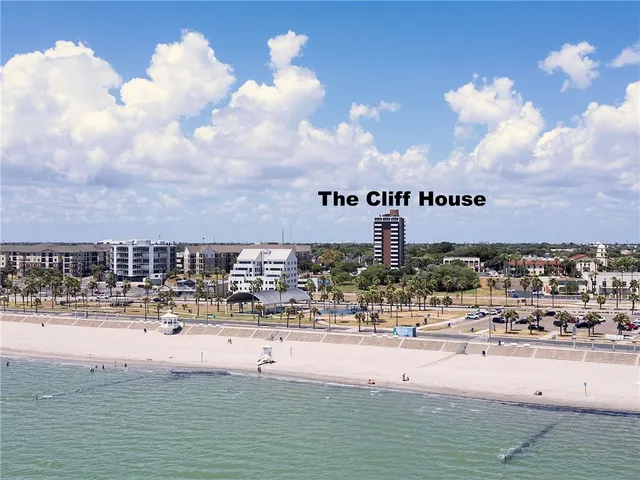 a swimming pool with outdoor seating and yard in back