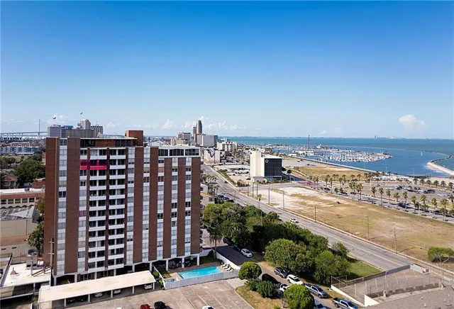 a view of city with ocean