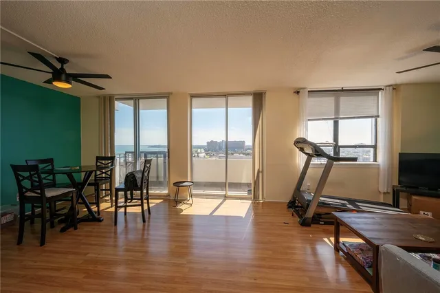 a view of a livingroom with furniture and a flat screen tv
