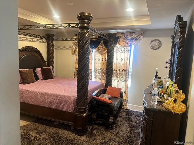 a bedroom with a bed and a mirror