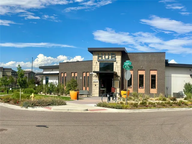 a view of a patio with couches table and chairs and potted plants