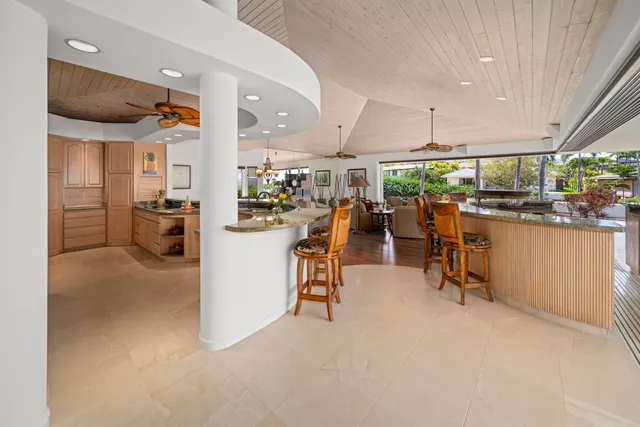 a kitchen with stainless steel appliances granite countertop a refrigerator and a sink