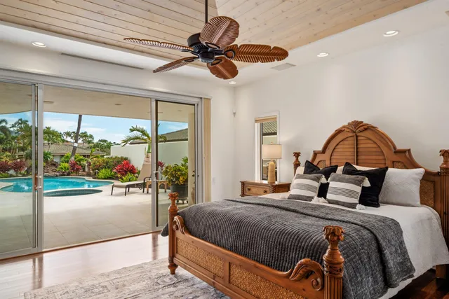 a bed room with a bed window and a television