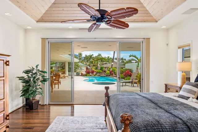 a large kitchen with kitchen island a island a sink stainless steel appliances and cabinets