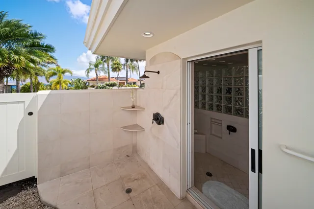 a bedroom with a bed and a table in it with wooden floor