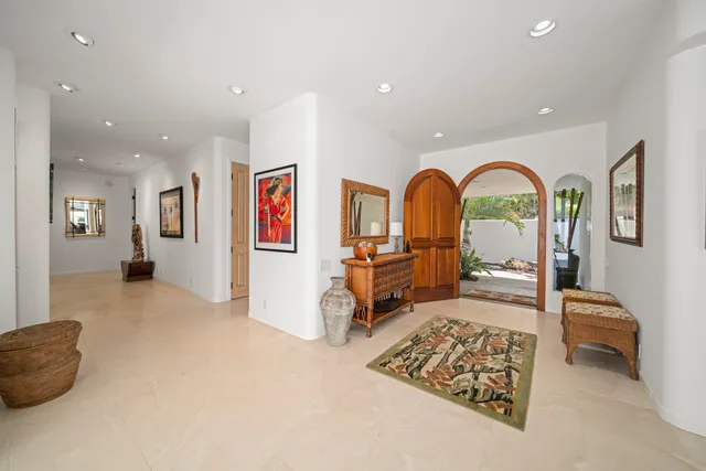 a living room with furniture rug and a window