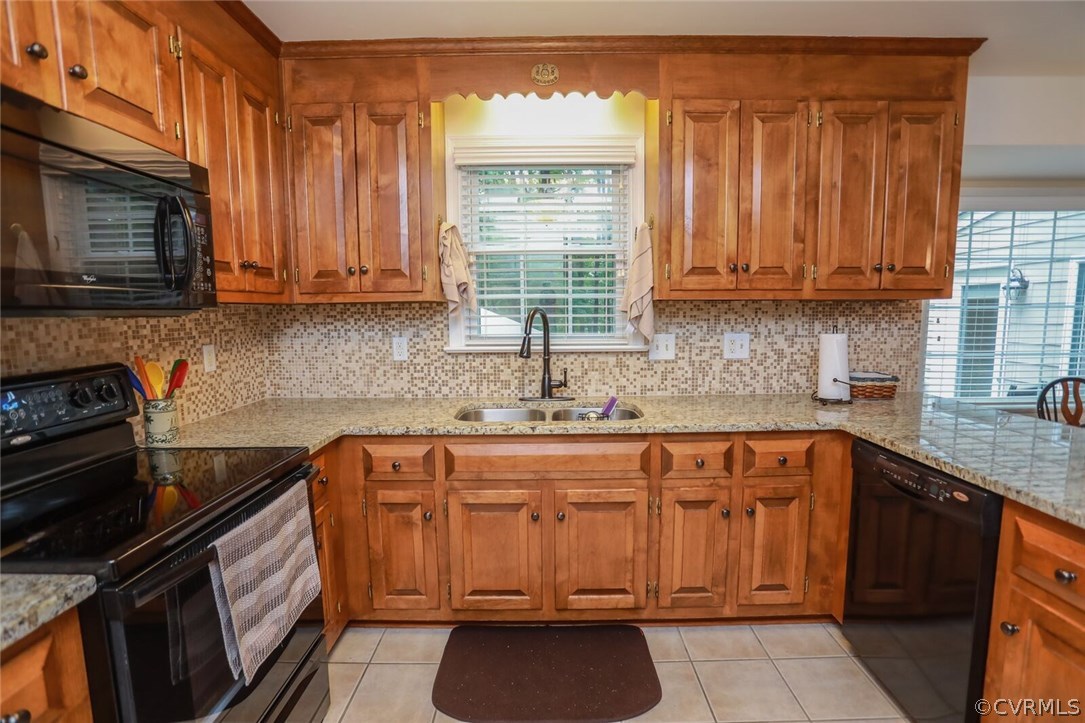 3002 Cove Ridge Road Midlothian, VA 23112 - Photo 13 of 36 a kitchen with stainless steel appliances granite countertop a stove sink and cabinets