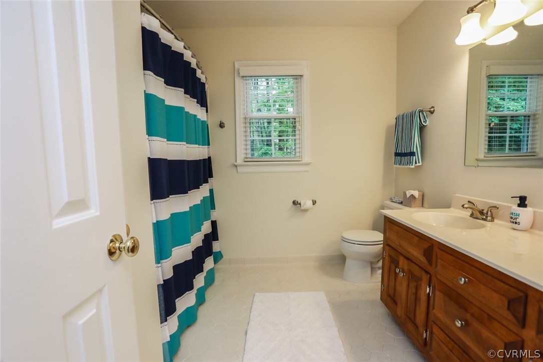 3002 Cove Ridge Road Midlothian, VA 23112 - Photo 26 of 36 a spacious bathroom with a sink and a mirror